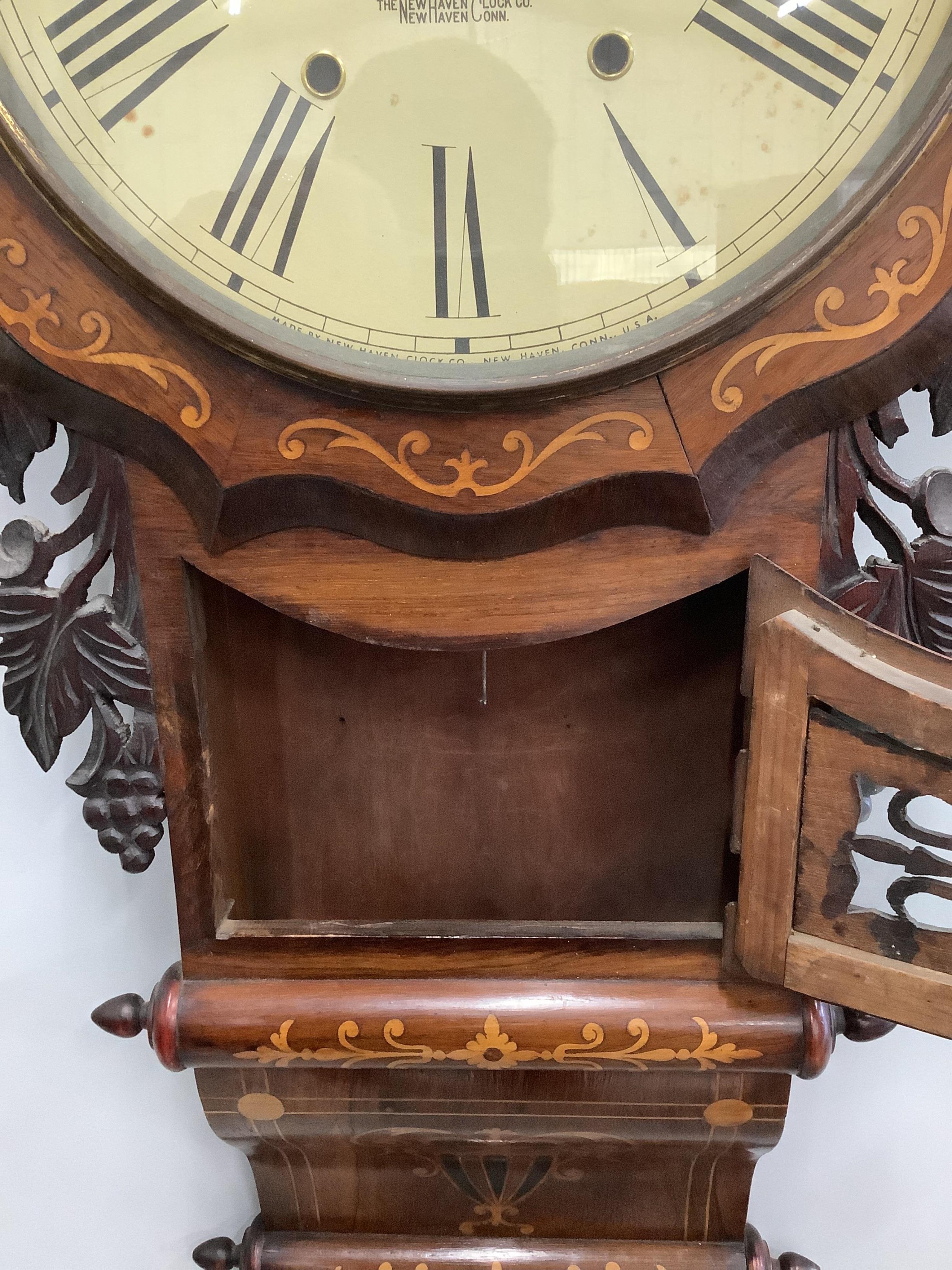 A late 19th century Newhaven Clock Company rosewood and marquetry inlaid drop dial wall timepiece, height 80cm. Condition - fair